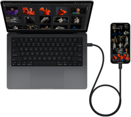 iPhone 15 Pro Max podłączony do 14‑calowego MacBooka Pro przez złącze USB‑C